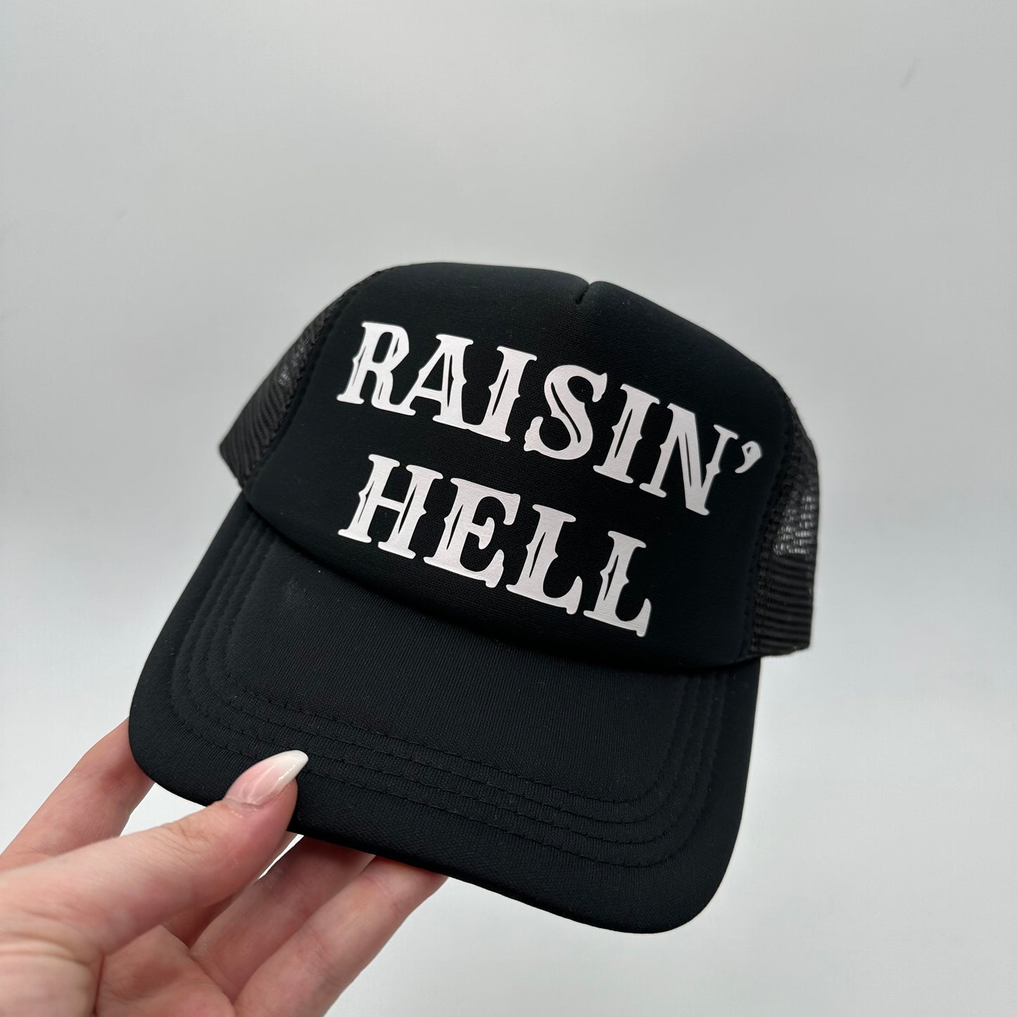 Raisin’ Hell Black trucker hat